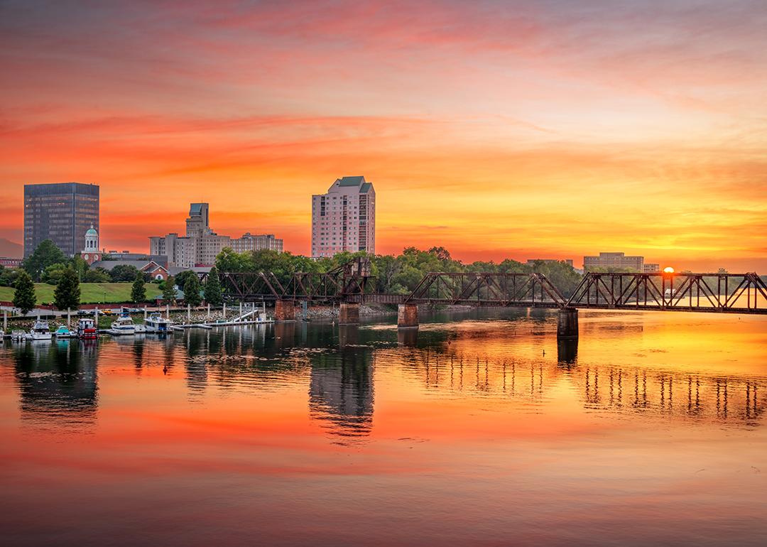 A downtown skyline view of the Savannah River, GA during sunset.