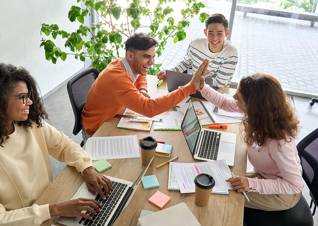 A group of young multicultural creative team having great teamwork.