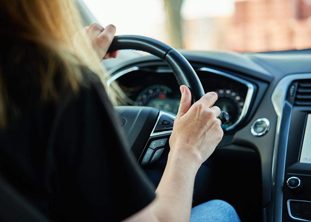 A woman driving a car.