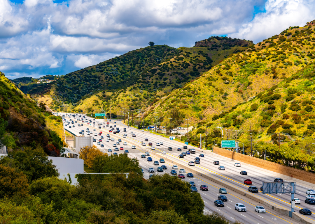 Aerial view of California Interstate 405 near Los Angeles surrounded by green hills