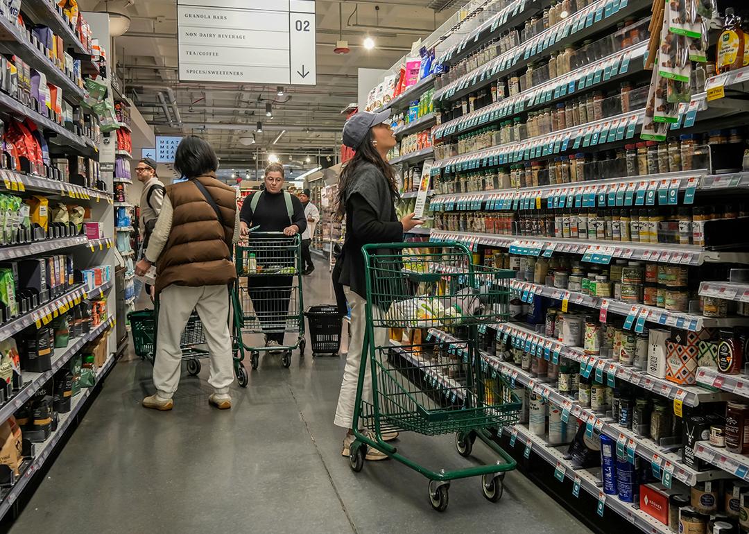 Consumers looking at the tea, coffee and spices aisle in a supermarket in New York.