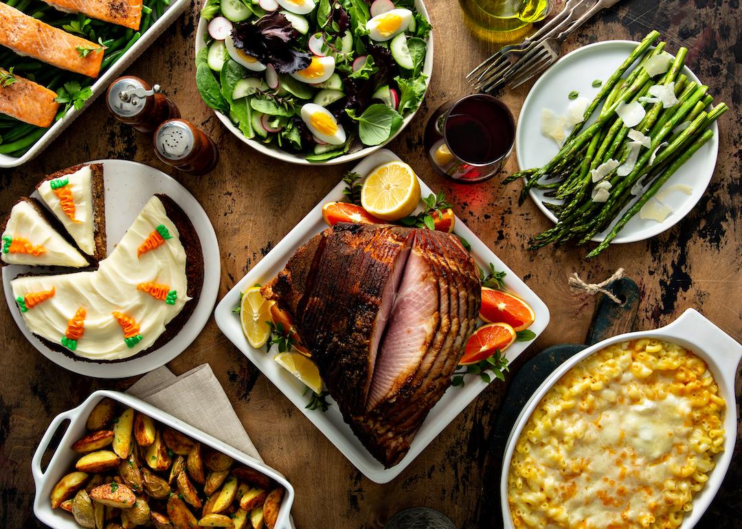 Easter dinner table with ham, asparagus, and carrot cake.