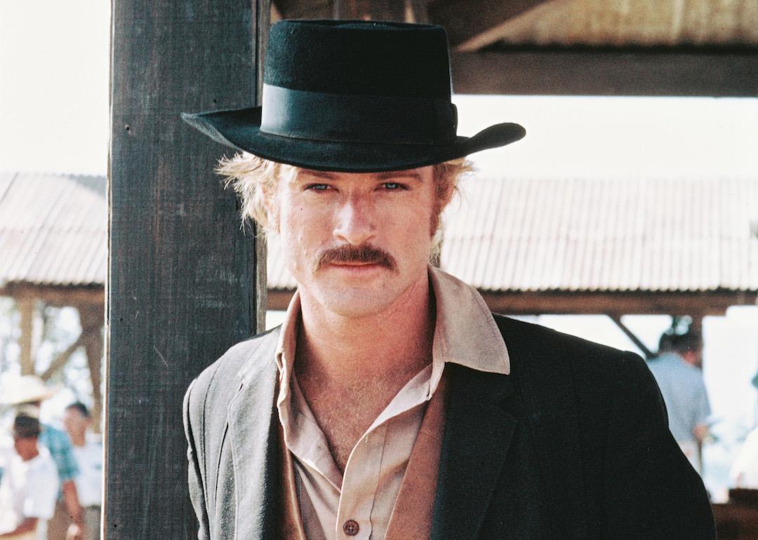 Actor Robert Redford in a black cowboy hat and tan leather waistcoat, in a publicity portrait issued for the 1969 Western film 'Butch Cassidy and the Sundance Kid.'