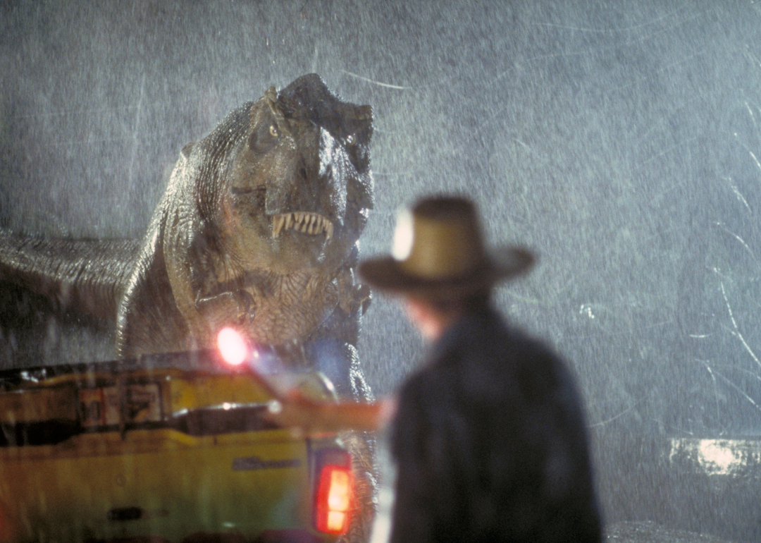 Actor Sam Neill as Dr. Alan Grant takes on a Tyrannosaurus Rex in a scene from the film 'Jurassic Park', 1993.