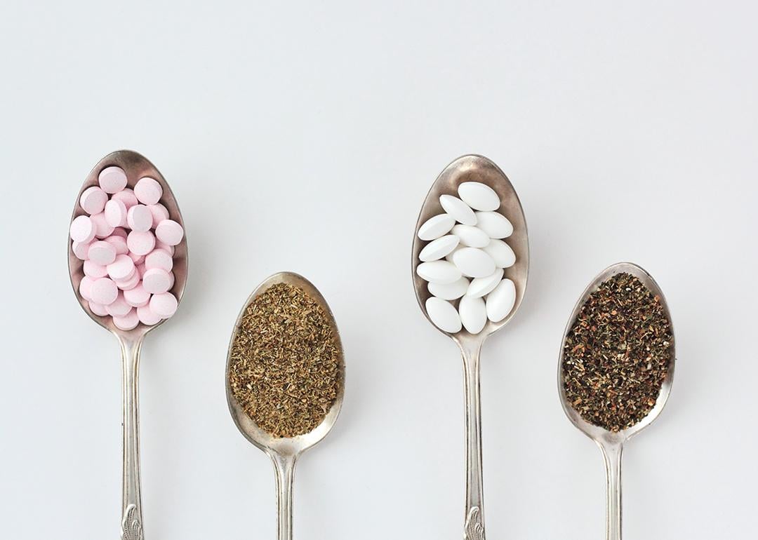 Spoonfuls of supplements such as chamomile, magnesium pills, vitamin B complex pills and lemon balm.
