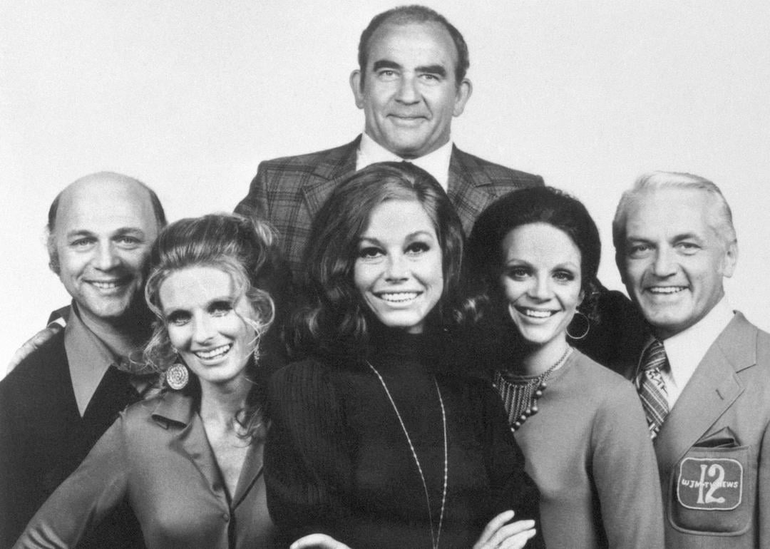 The cast of 'The Mary Tyler Moore Show,' from left to right: Gavin MacLeod, Cloris Leachman, Mary Tyler Moore, Valerie Harper, and Ted Knight. At top, is Ed Asner.