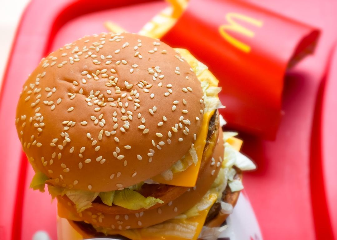 Big mac burger and fries from McDonald's on a red tray.