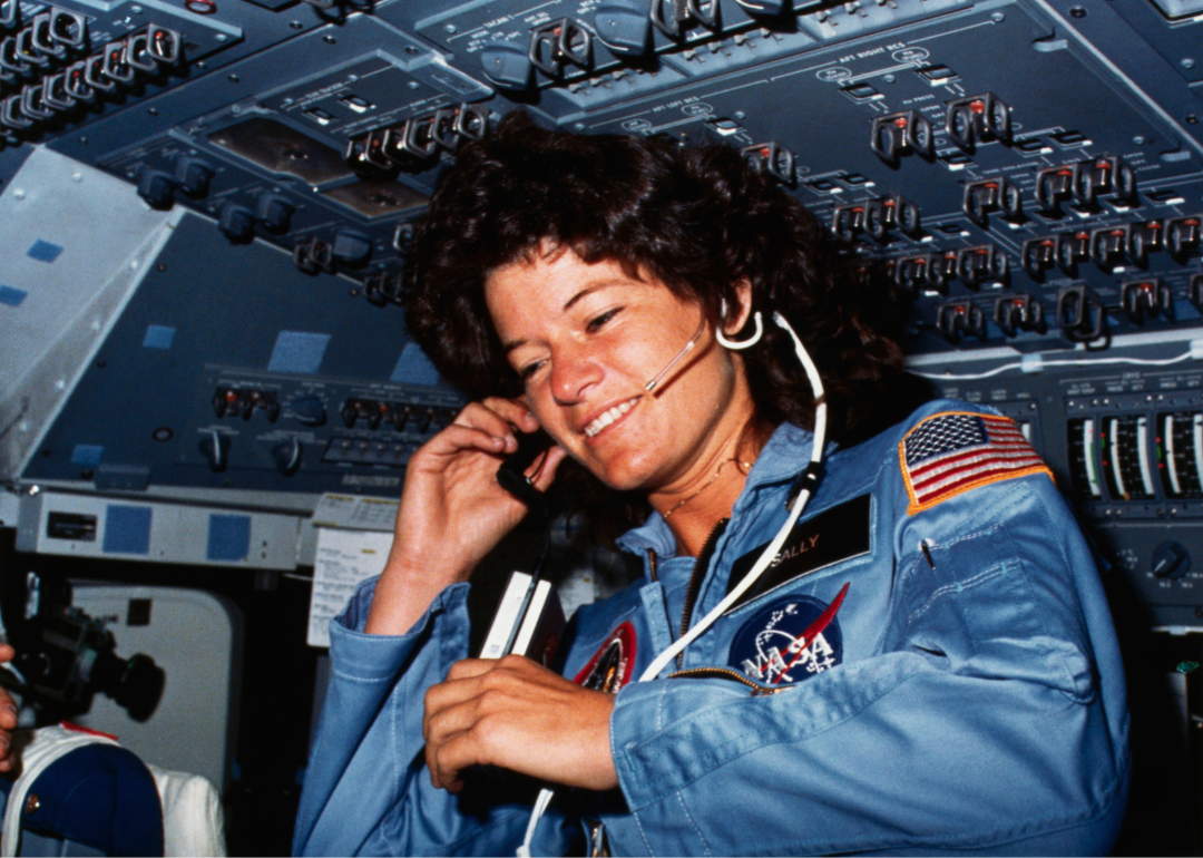 Astronaut Sally K. Ride, STS-7 mission specialist, communicates with ground controllers from the flight deck of the Earth-orbiting Space Shuttle Challenger, circa 1983.