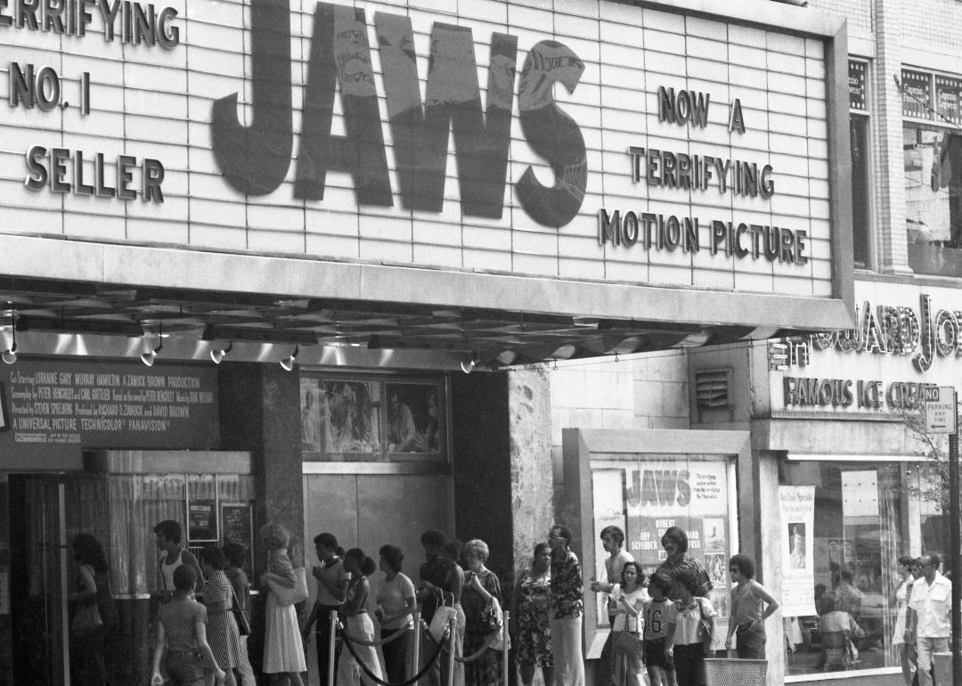 Crowds line up outside a movie theater to see 'Jaws,' circa 1975