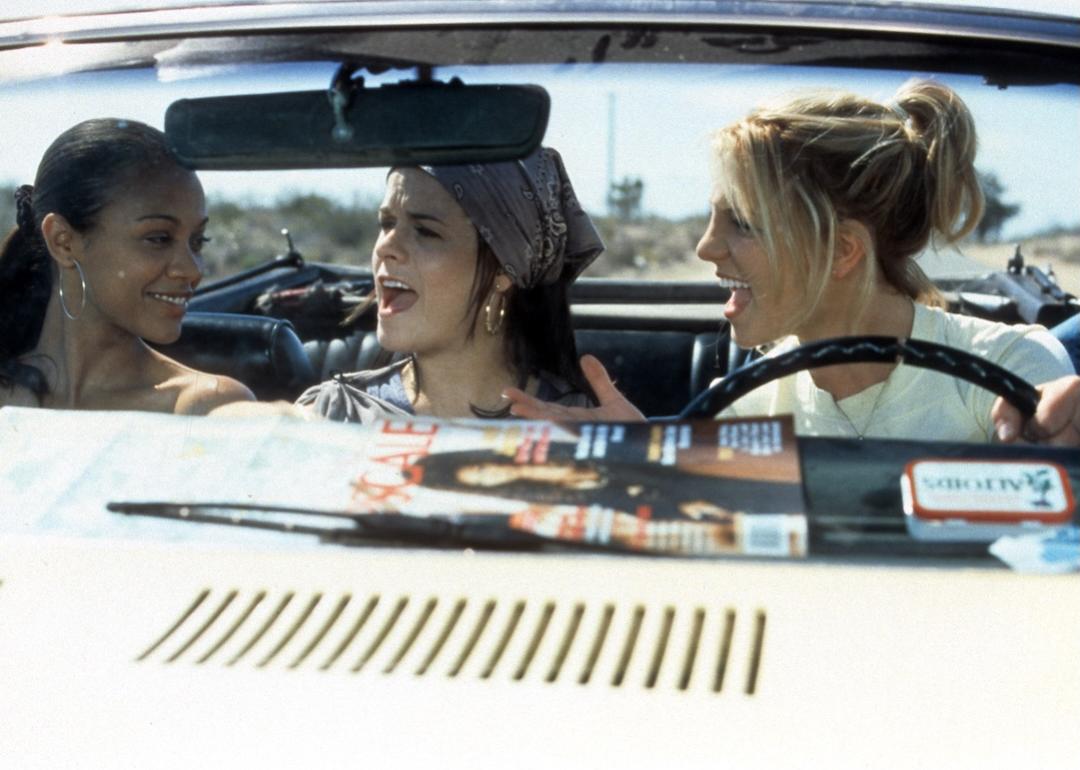 Zoe Saldana, Taryn Manning, and Britney Spears ride in a car in a scene from "Crossroads."