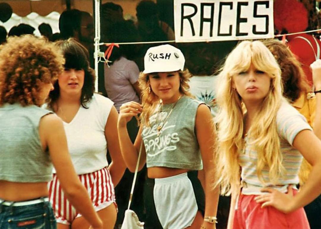 Four women hanging out at a festival