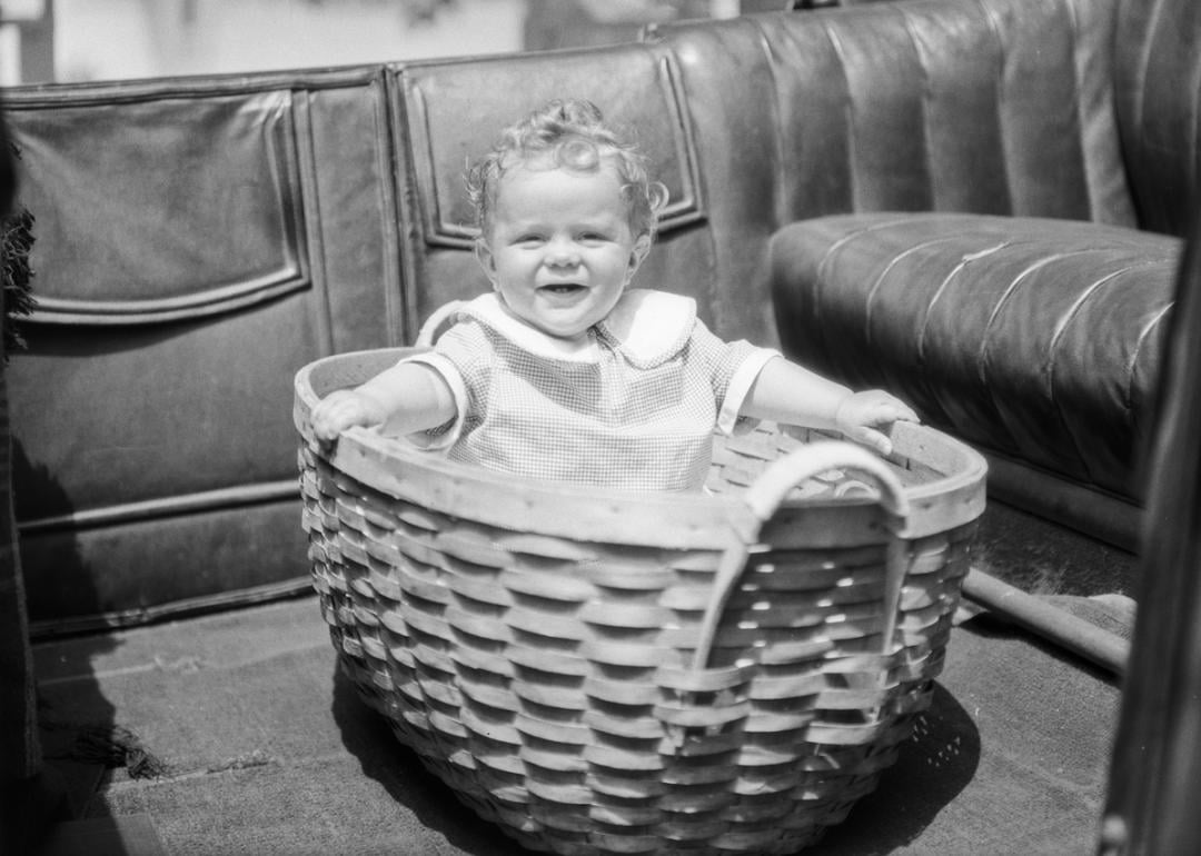 Infant, man and Martin shock absorber, Southern California, 1926.