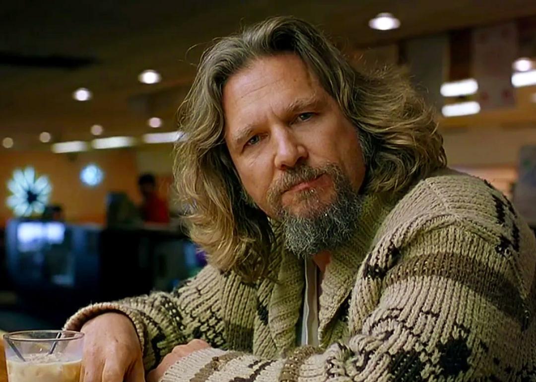 Jeff Bridges as The Big Lebowski sitting in the bowling alley