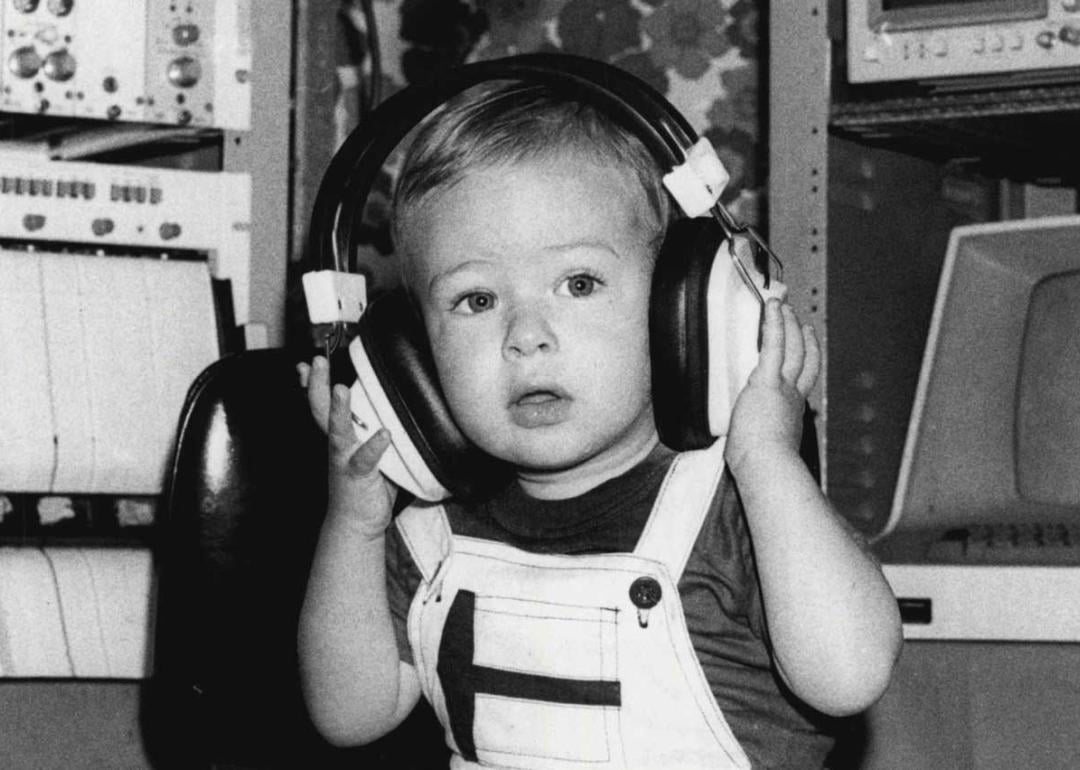 Baby in 1991 wearing headphones during an auditory test.