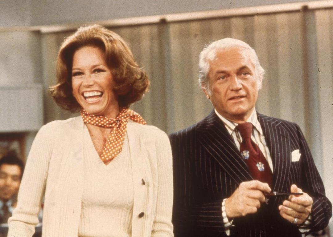 American actors Mary Tyler Moore and Ted Knight laugh in a still from the television series, 'The Mary Tyler Moore Show,' circa 1976.