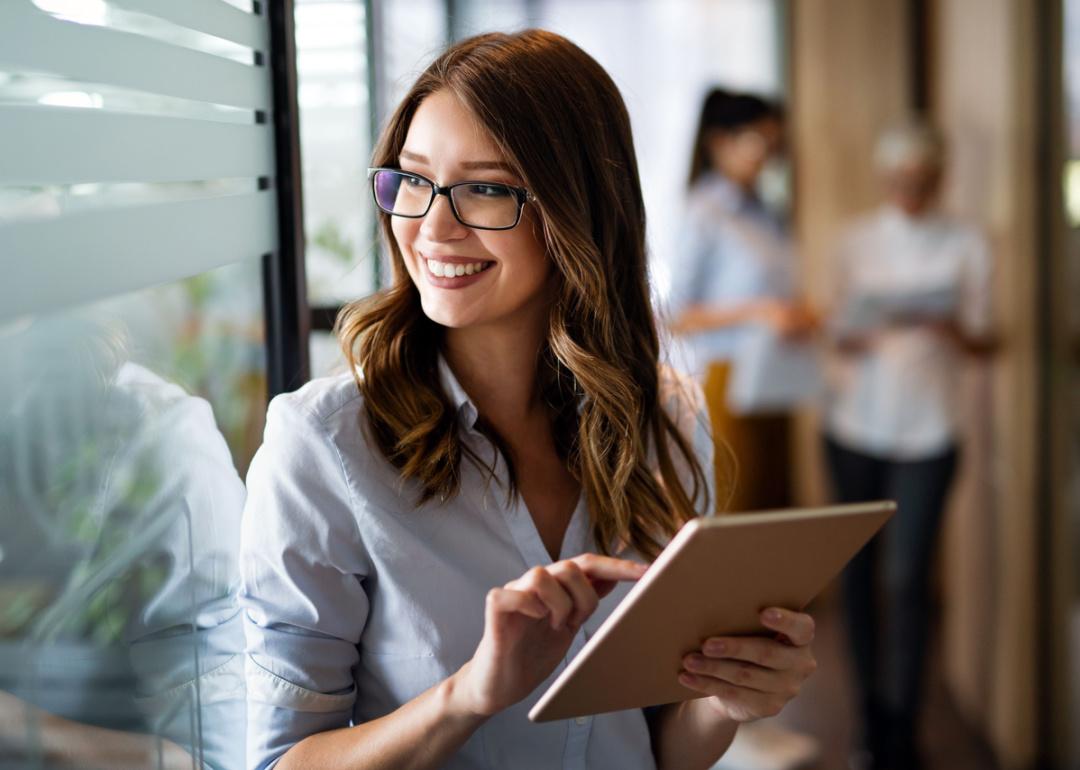 Woman working with tablet in office.