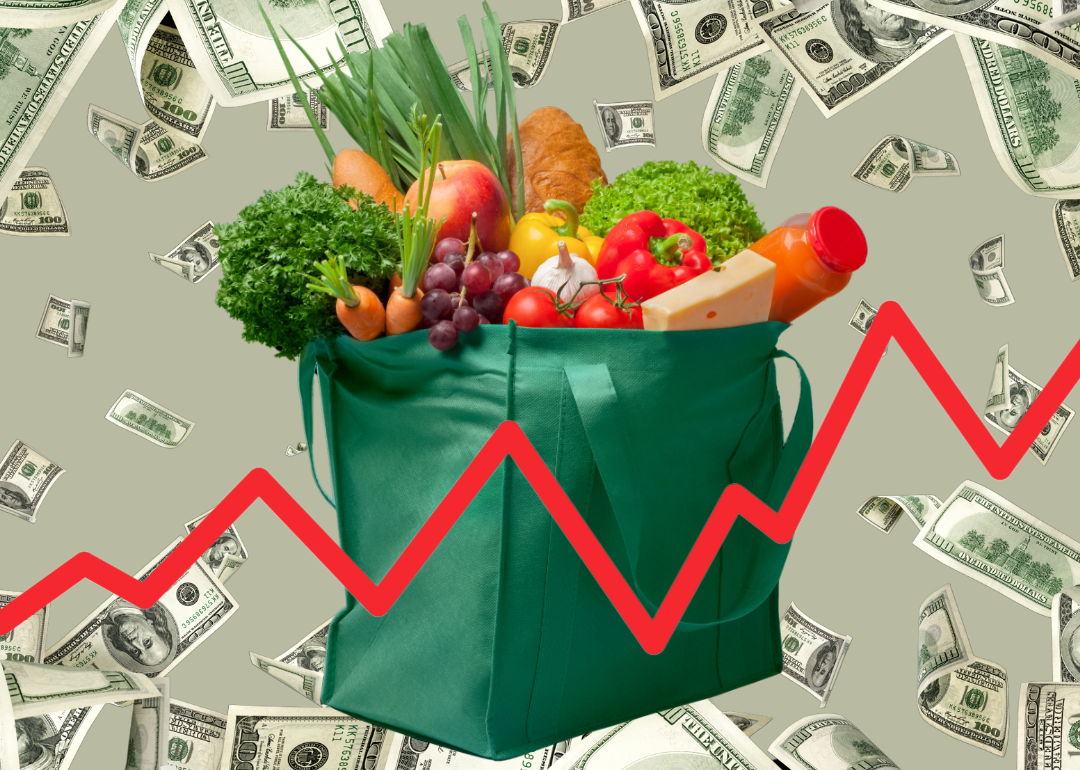 An illustration of a bag of groceries against a background of cash with a red line chart in the foreground.