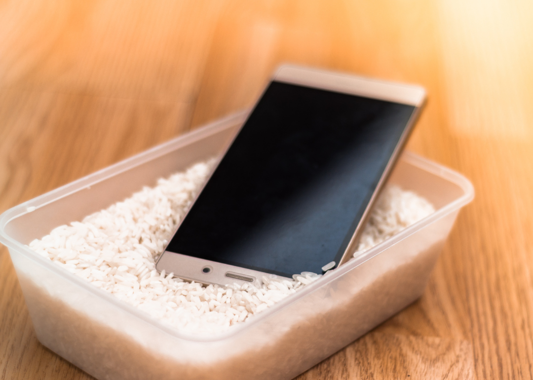 A smartphone in a bowl of rice.