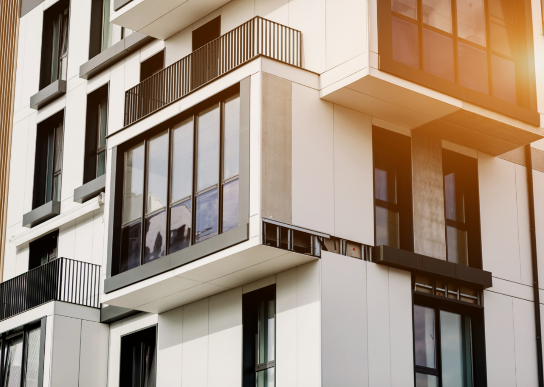 A modern apartment building at sunset.