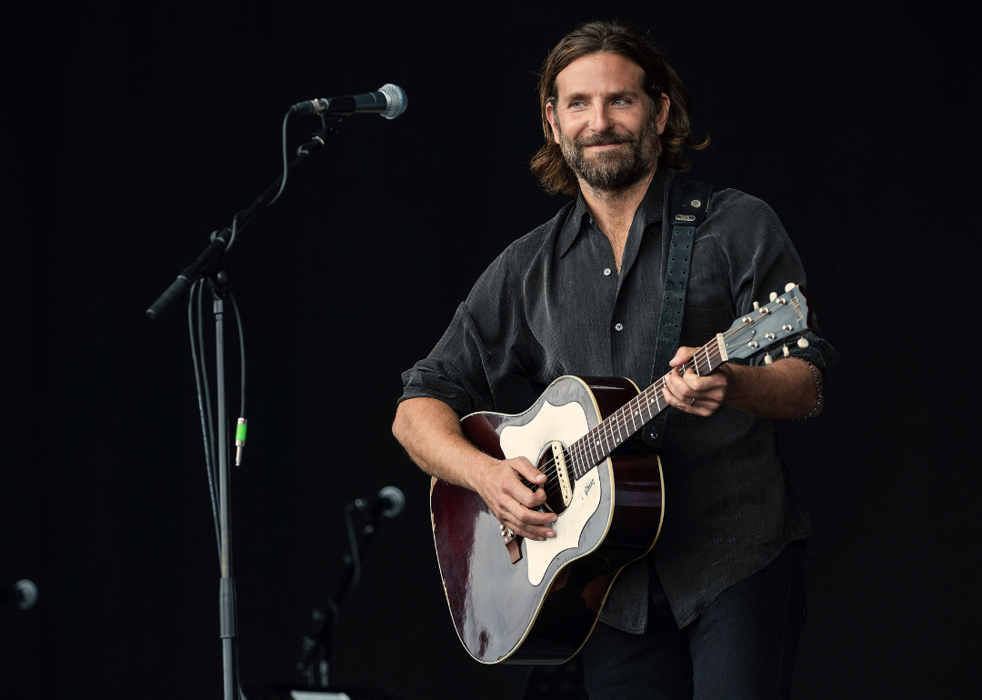 Bradley Cooper performs on the Pyramid stage to shoot footage for "A Star Is Born" at the 2017 the Glastonbury Festival.
