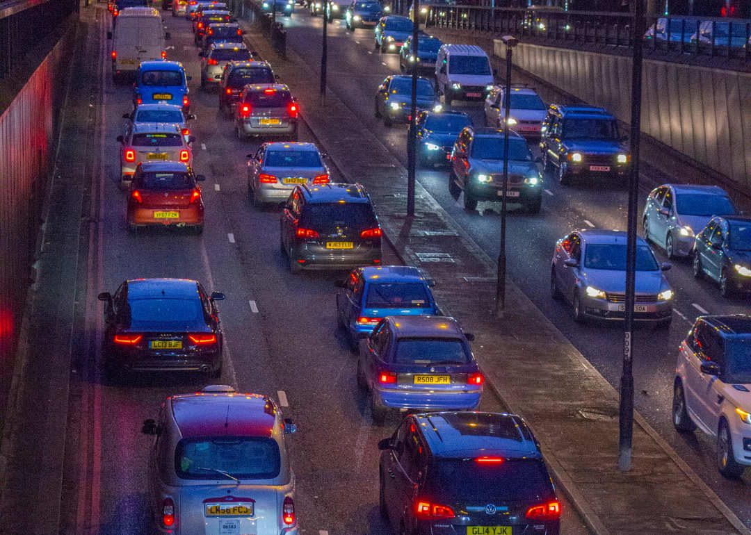 Cars stuck in traffic on the highway at night.