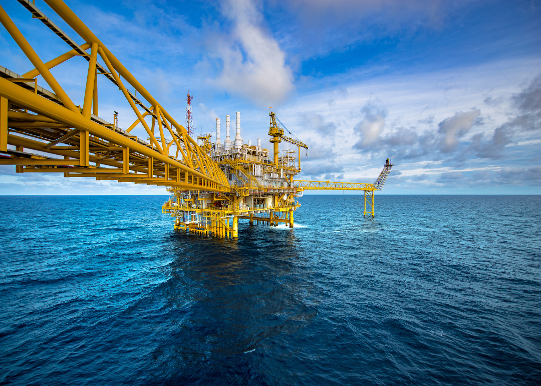 A yellow offshore oil rig.