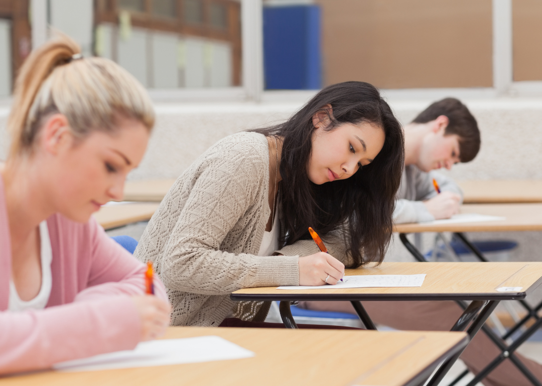 Students sitting at individual desks to take a standardized test