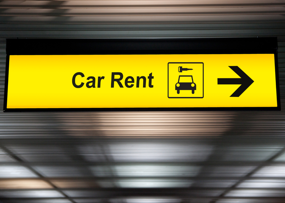 A sign pointing to where customers can rent a car