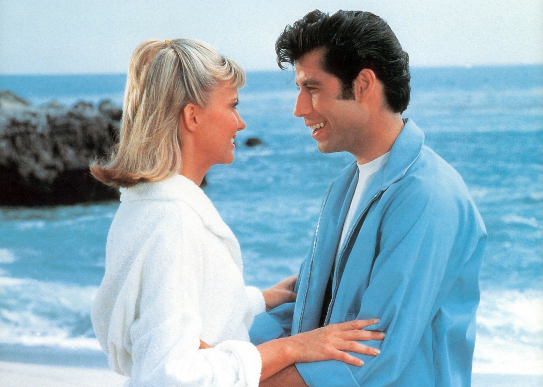 Olivia Newton-John and John Travolta on the beach in a scene from the film 'Grease.'