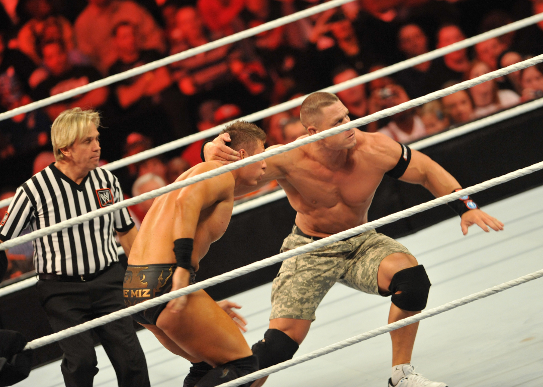 The Miz and John Cena battle during their WWE match.