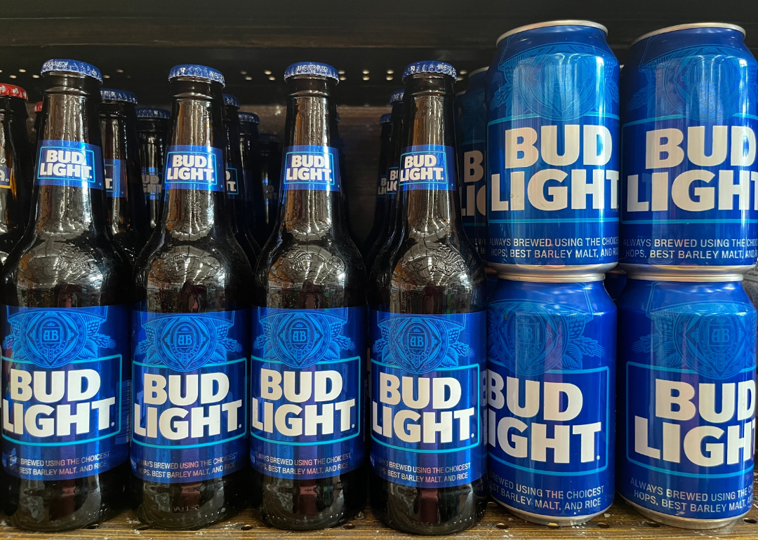 Bottles and cans of Bud Light on display on a store shelf