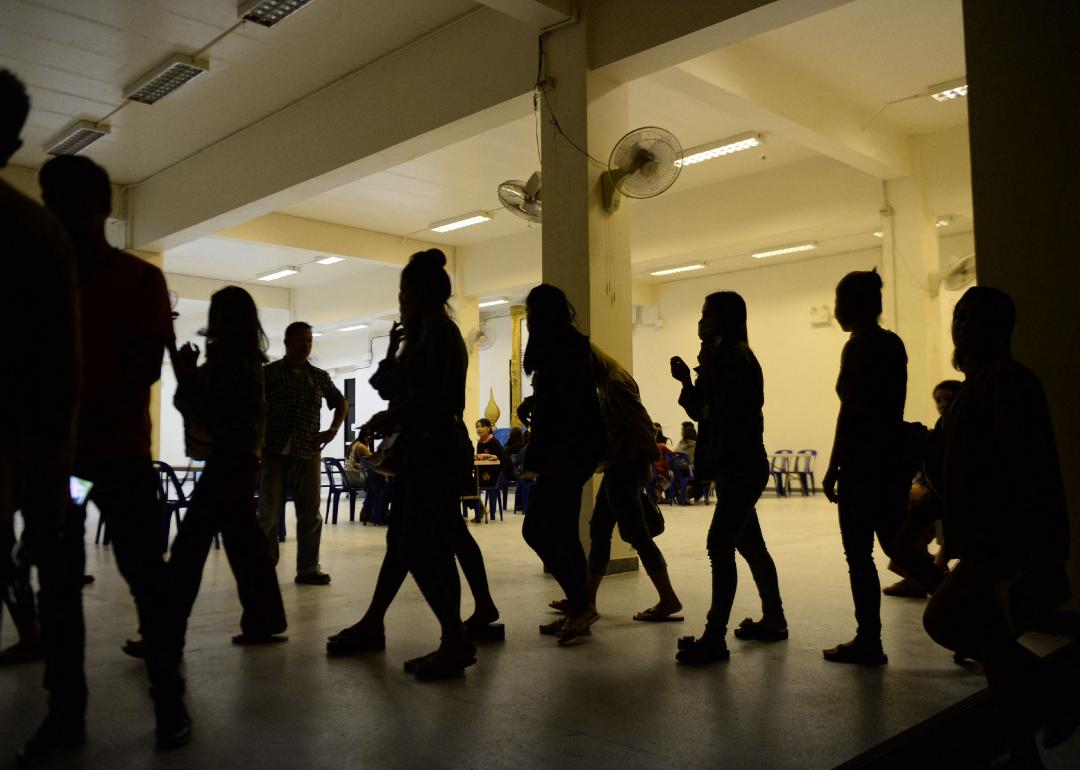 A group of foreign women rounded up by police from karaoke bars in Thailand.