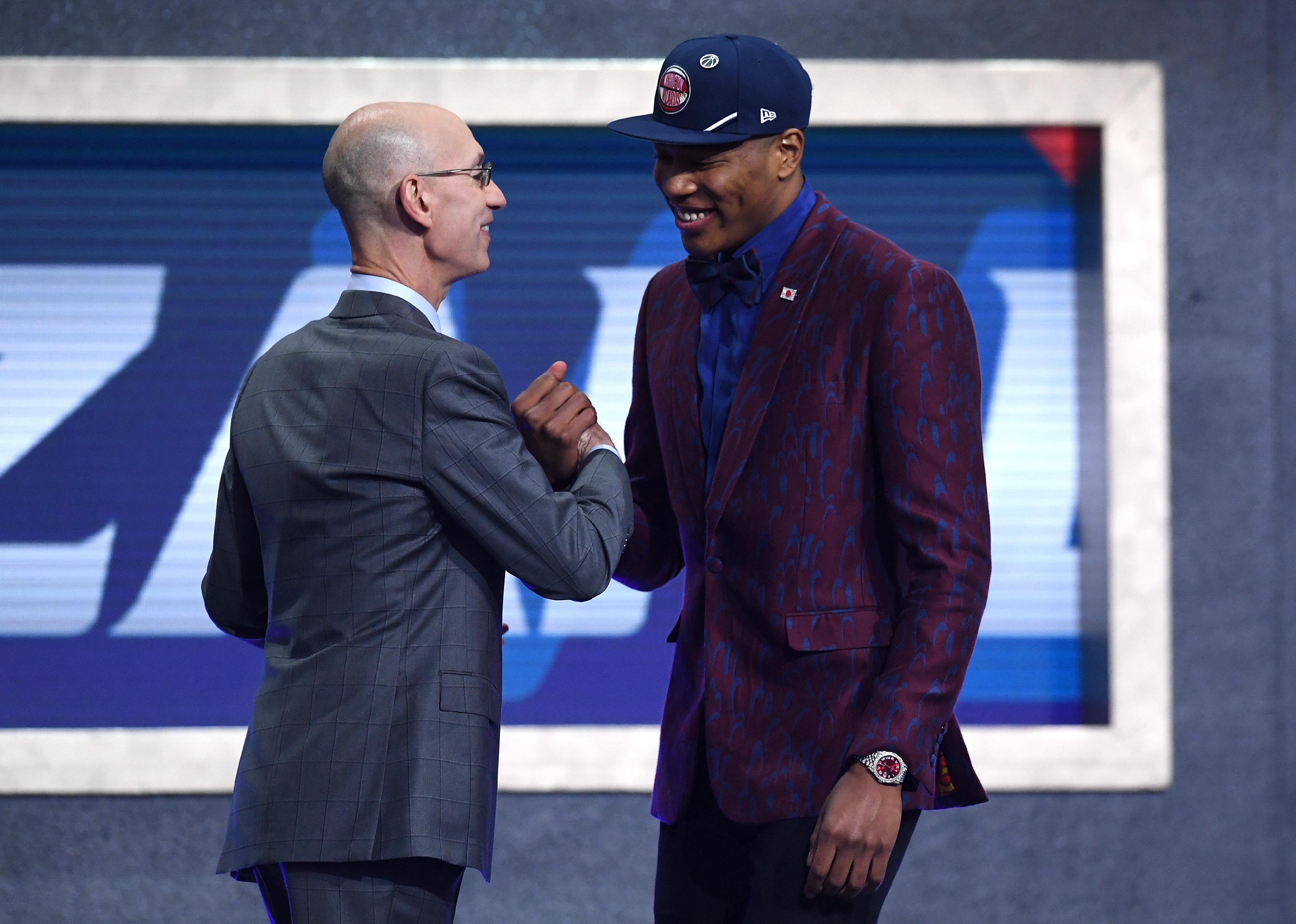 Rui Hachimura with NBA Commissioner Adam Silver after being drafted.