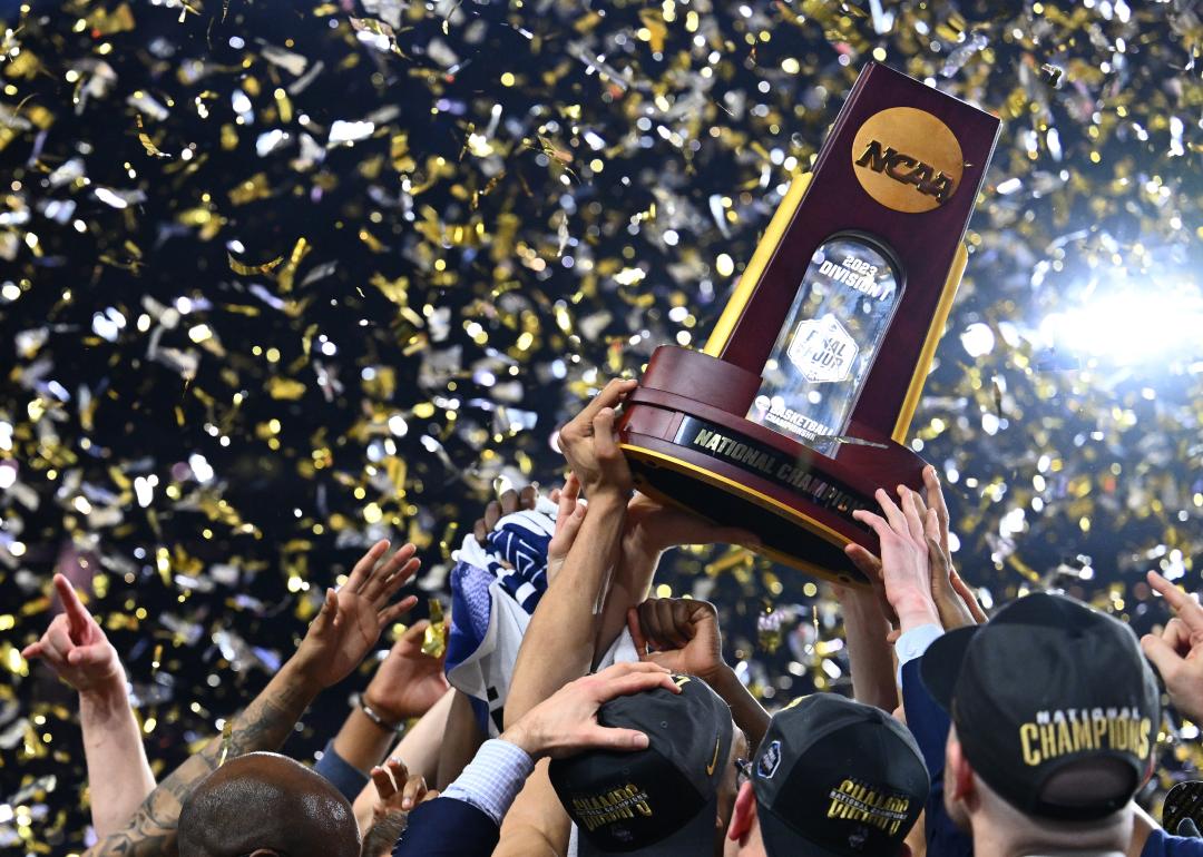 The Connecticut Huskies celebrate with the NCAA National Championship trophy.