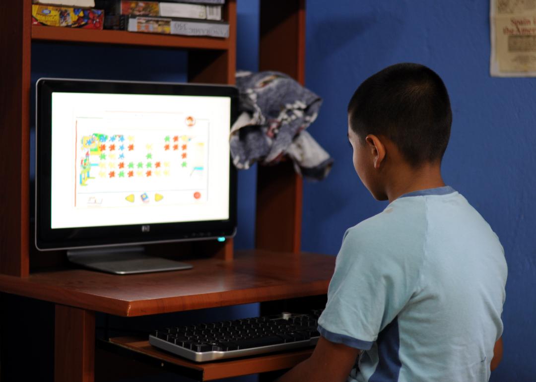  Boy playing educational computer game