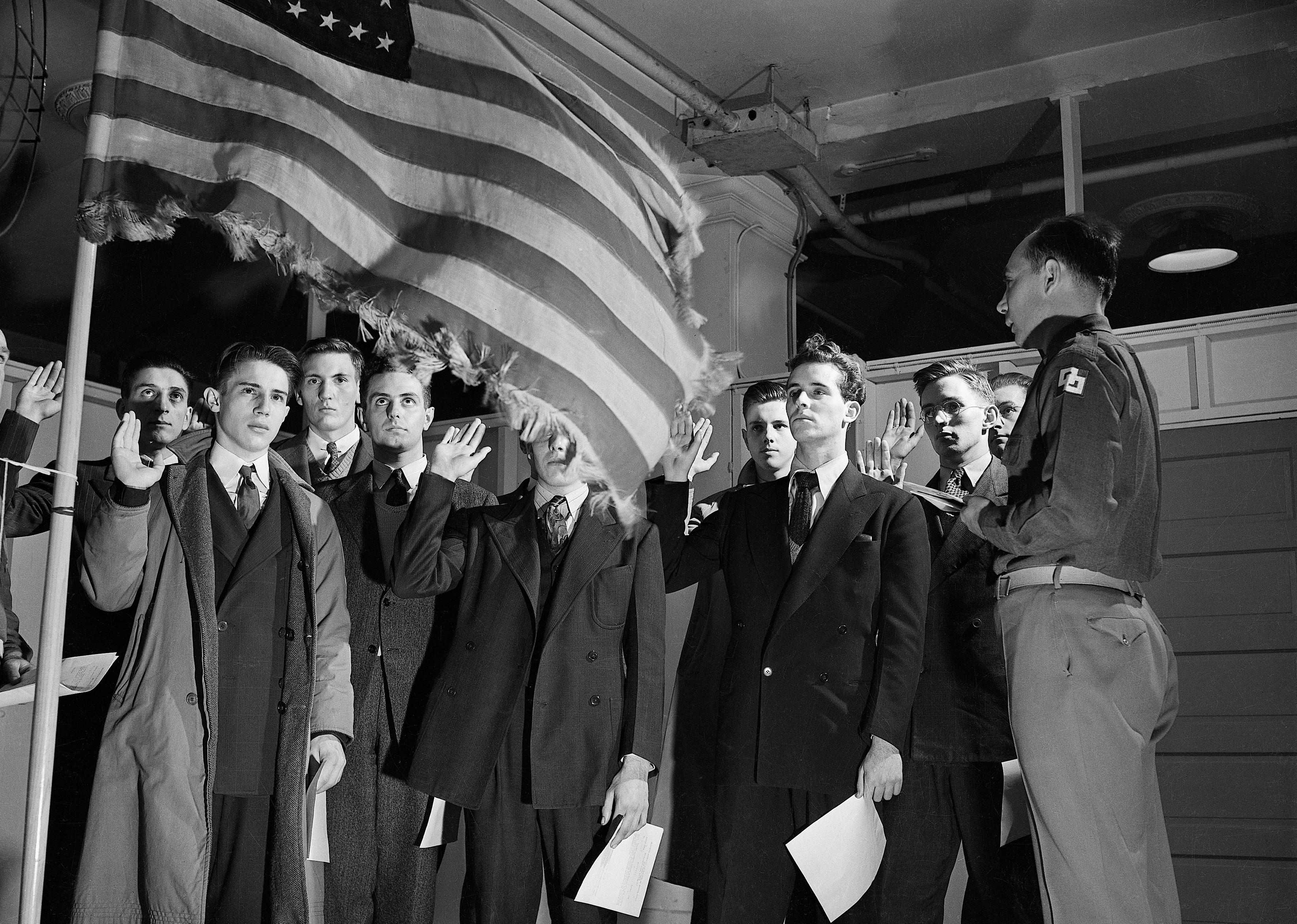 Eighteen- and 19-year-old men take their oath upon entering the receiving center at Camp Upton.