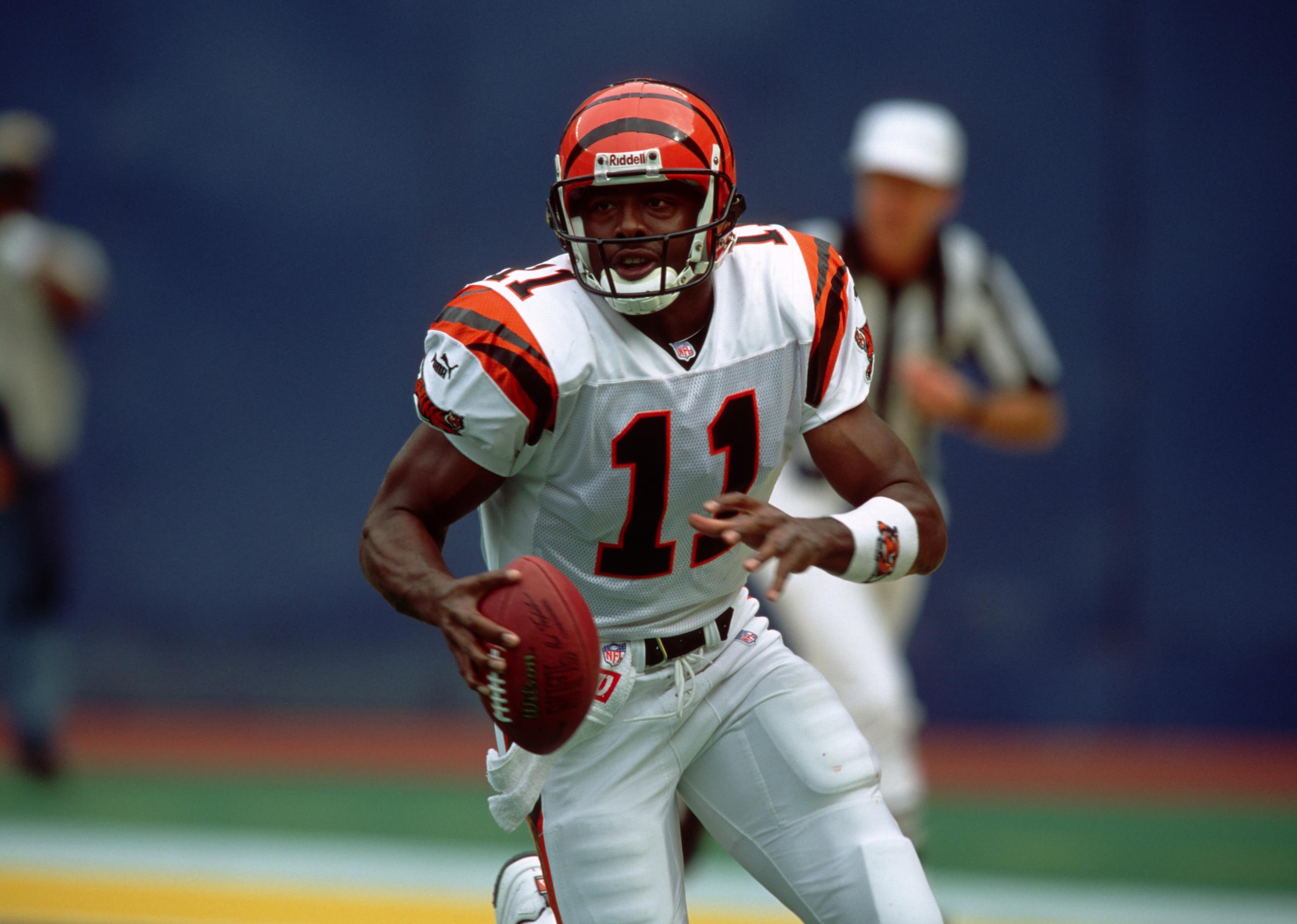 Quarterback Akili Smith of the Cincinnati Bengals scrambles while looking to pass.
