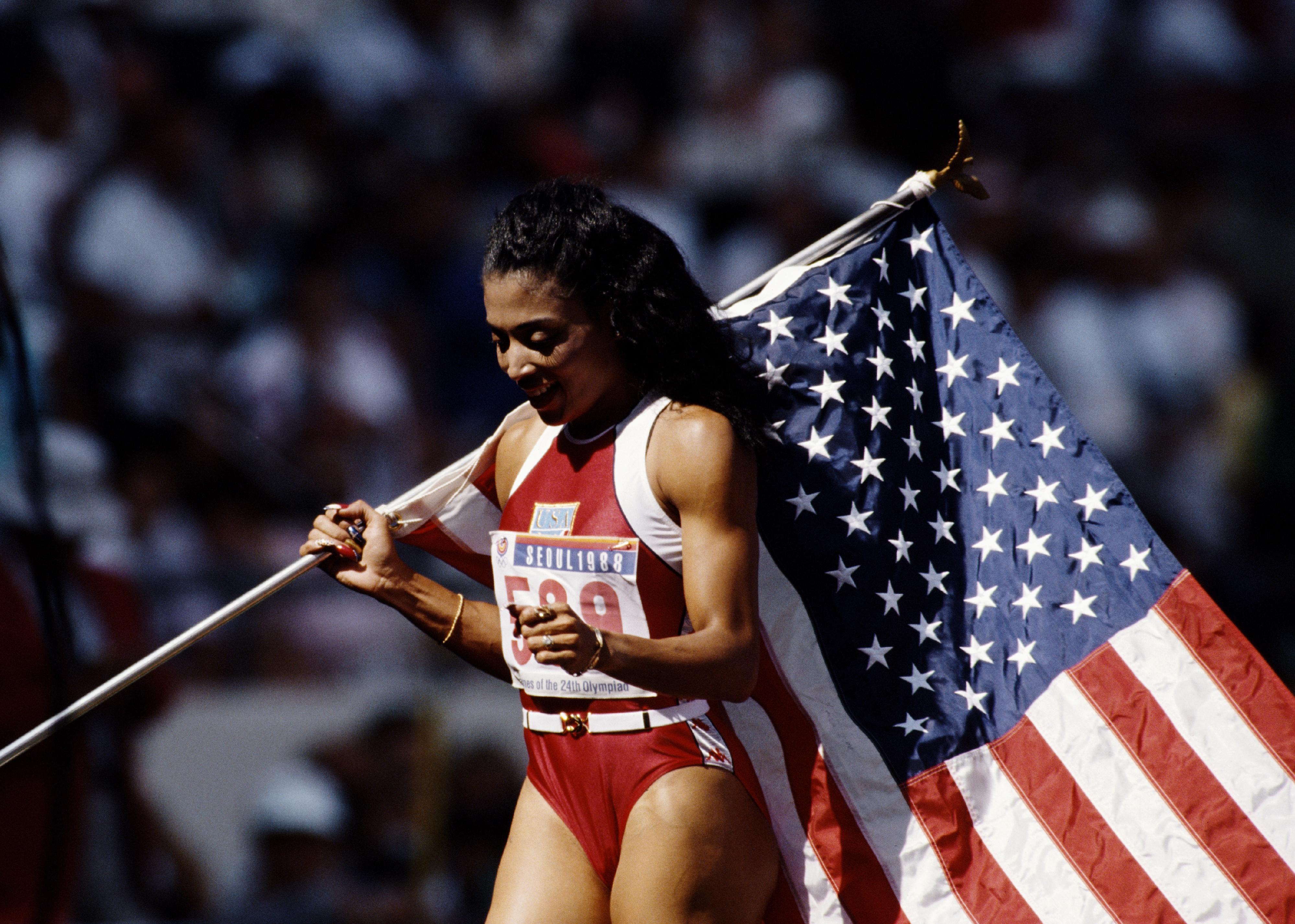 Full length of smiling athletic african-american sportswoman