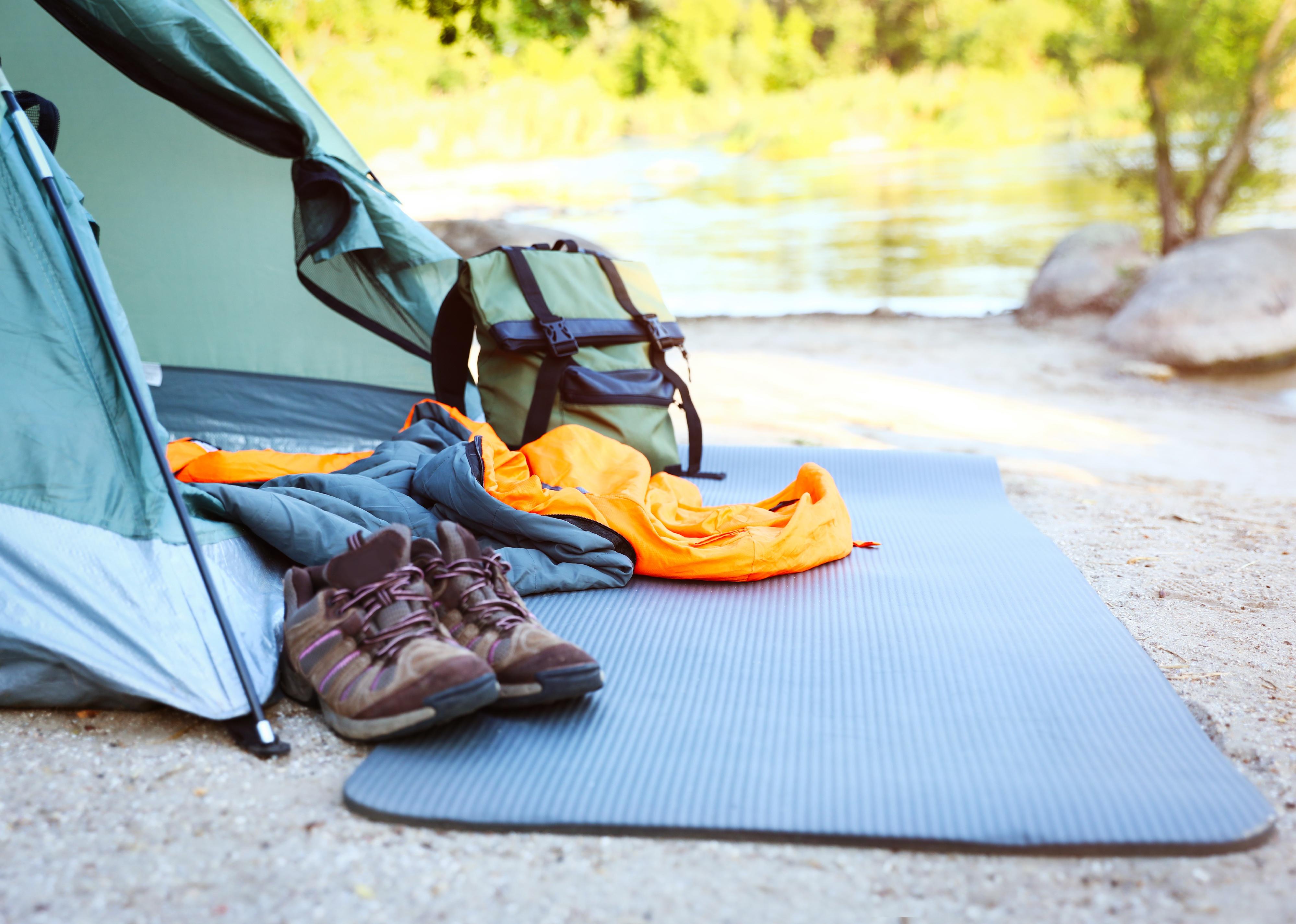 Sleeping bag and other camping gear outdoors