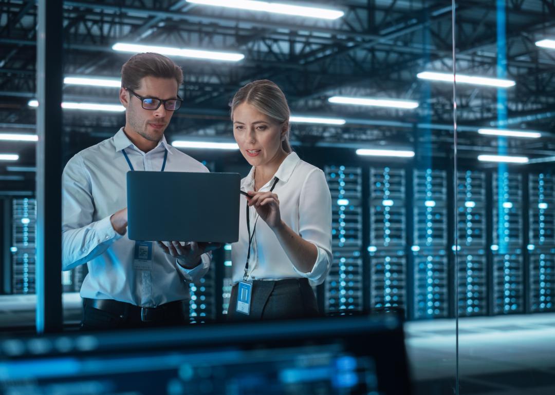 Two business people looking at a tablet.