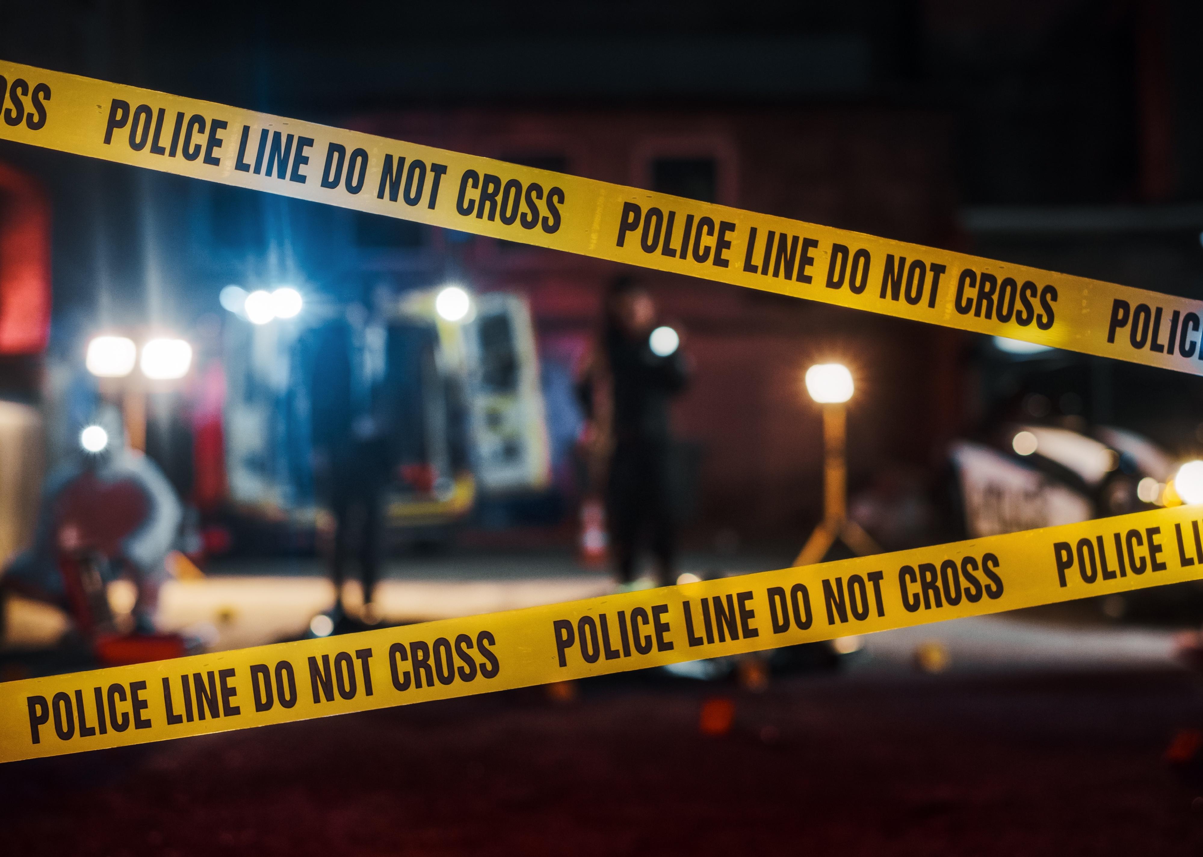 Crime scene with tape at night.