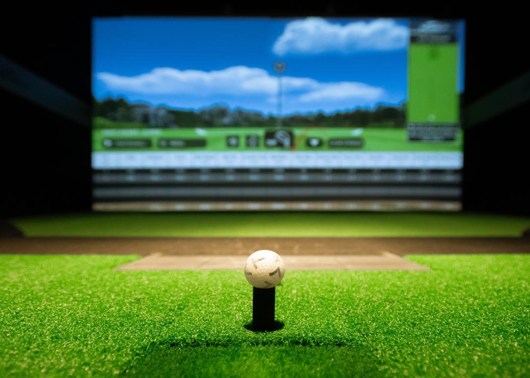 Golf ball on tee at simulator.