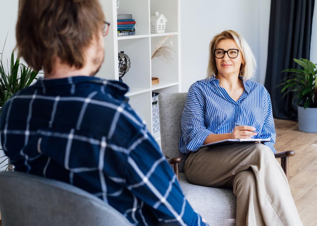 Female psychologist having session with male patient.