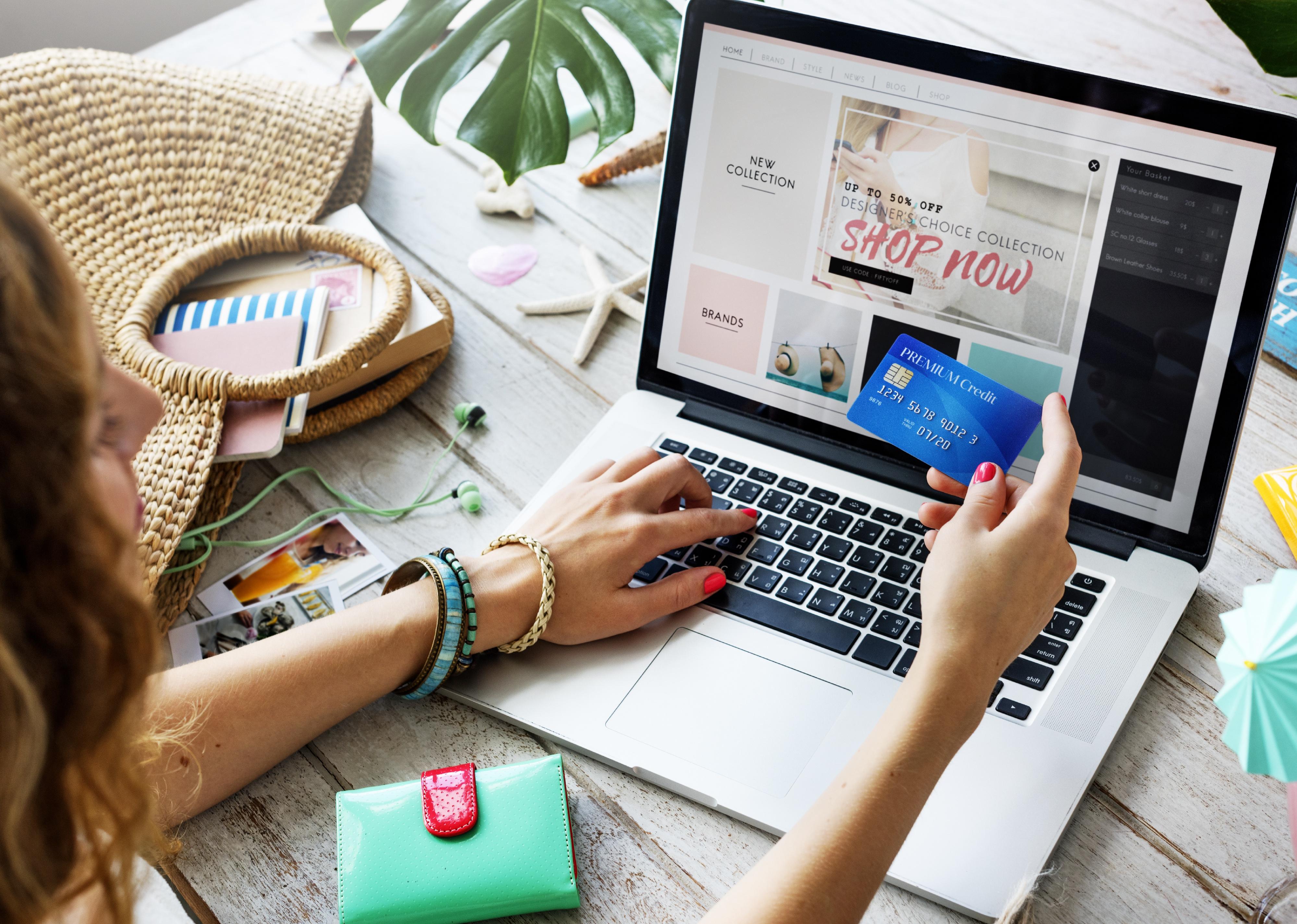 Woman holding credit card online shopping