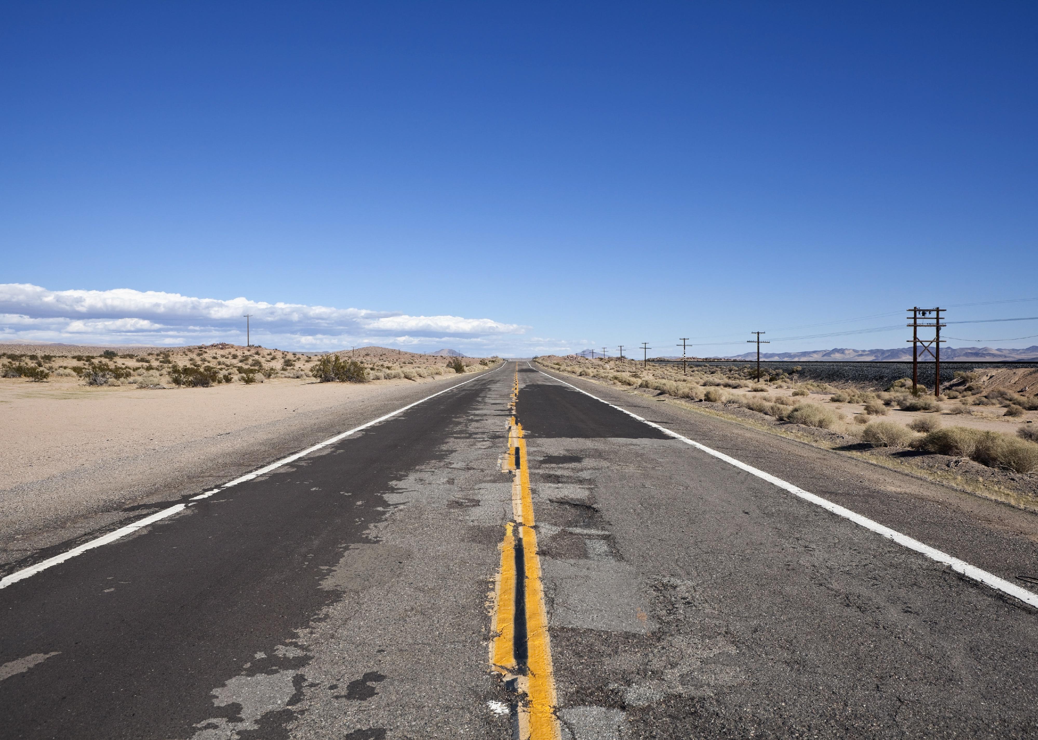 Damaged desert highway in California's harsh Mojave.
