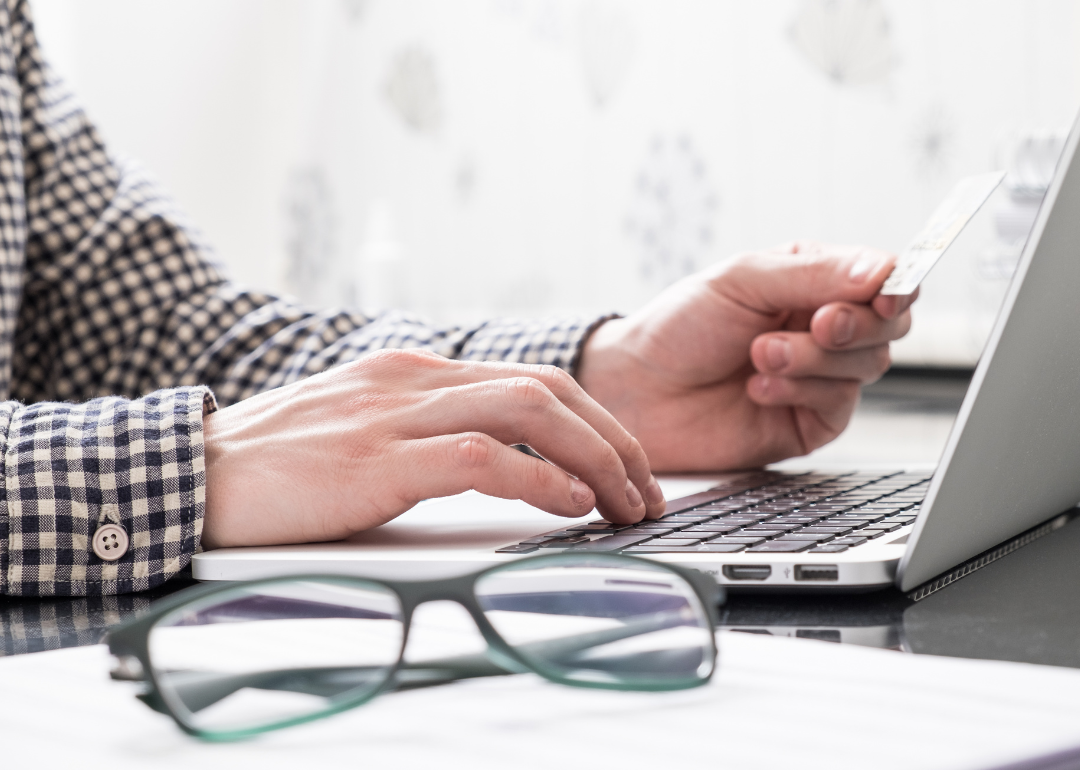 A person entering personal information into a computer.