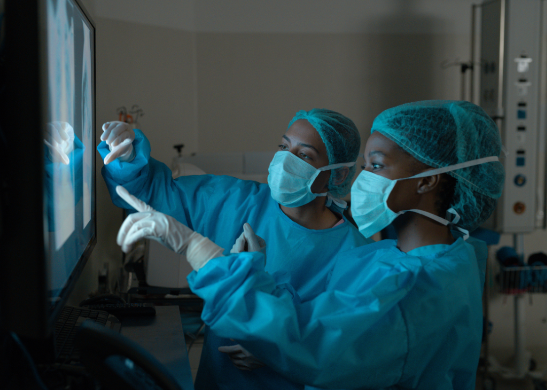 Two doctors looking at X-rays.