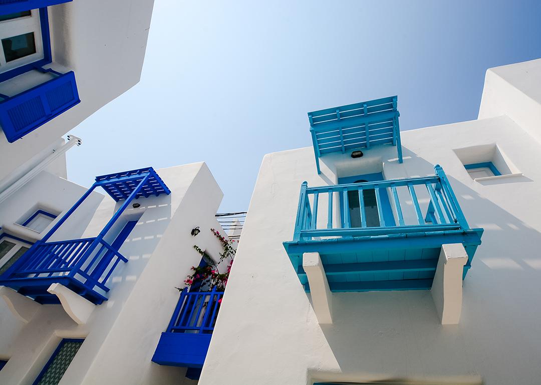 Daytime view of the exterior of Santorini, Greece-style buildings.
