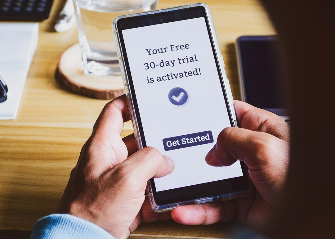 A user is seen activating a 30-day free trial of an app.