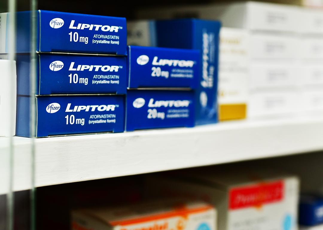 Boxes of Lipitor on a pharmacy shelf.